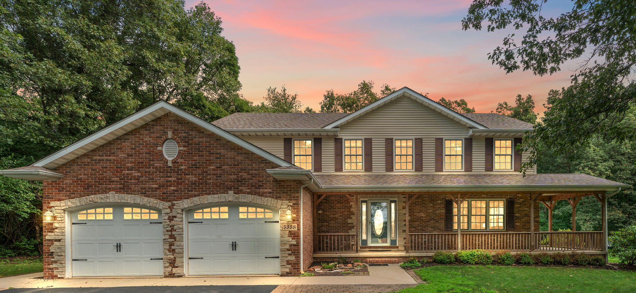 5338 East Lawler Court, Unit 67 Demotte, IN 46310 - Photo 2 of 49 a front view of a house with garden