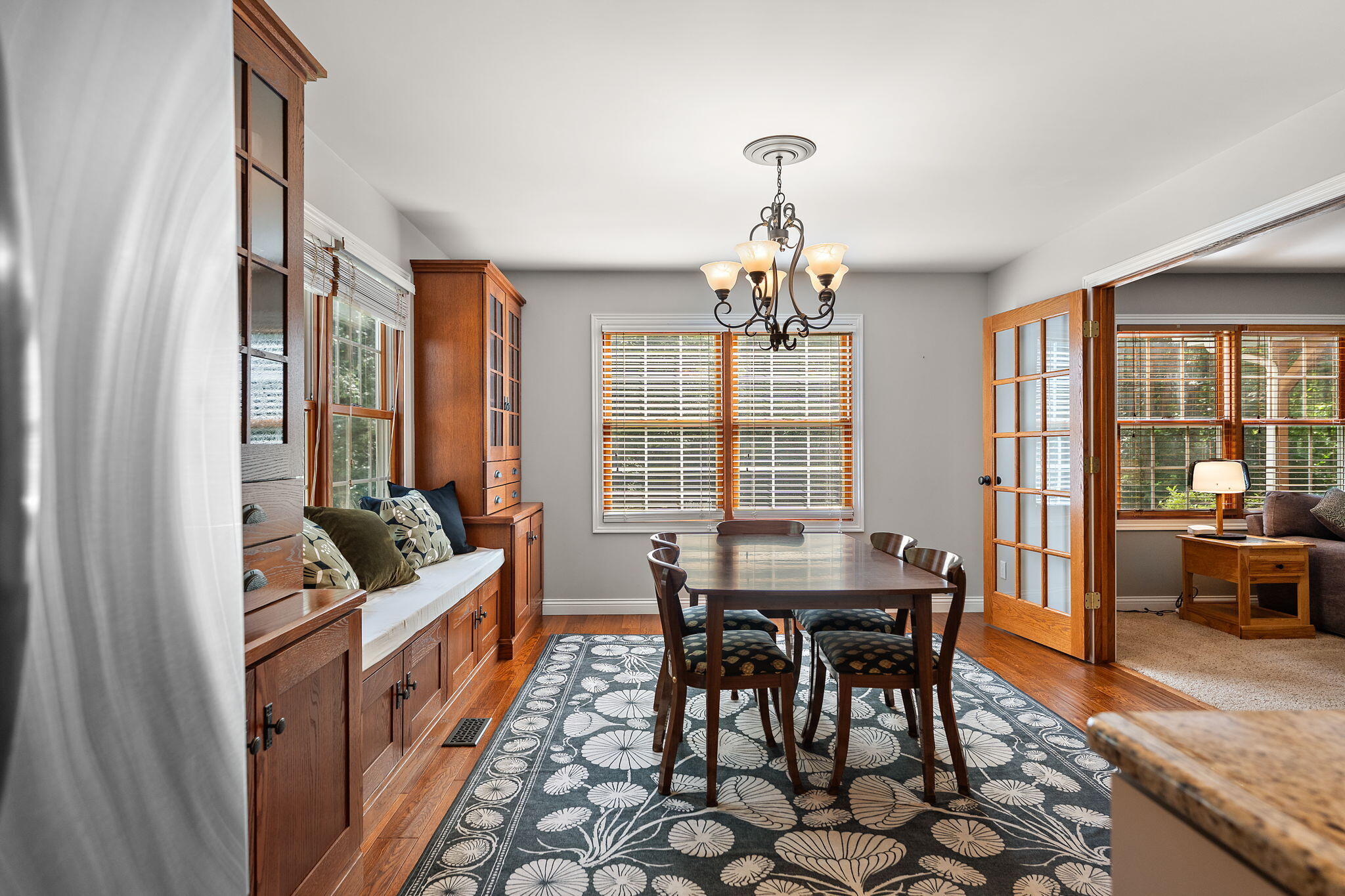 5338 East Lawler Court, Unit 67 Demotte, IN 46310 - Photo 21 of 49 a dining room with furniture a chandelier and wooden floor