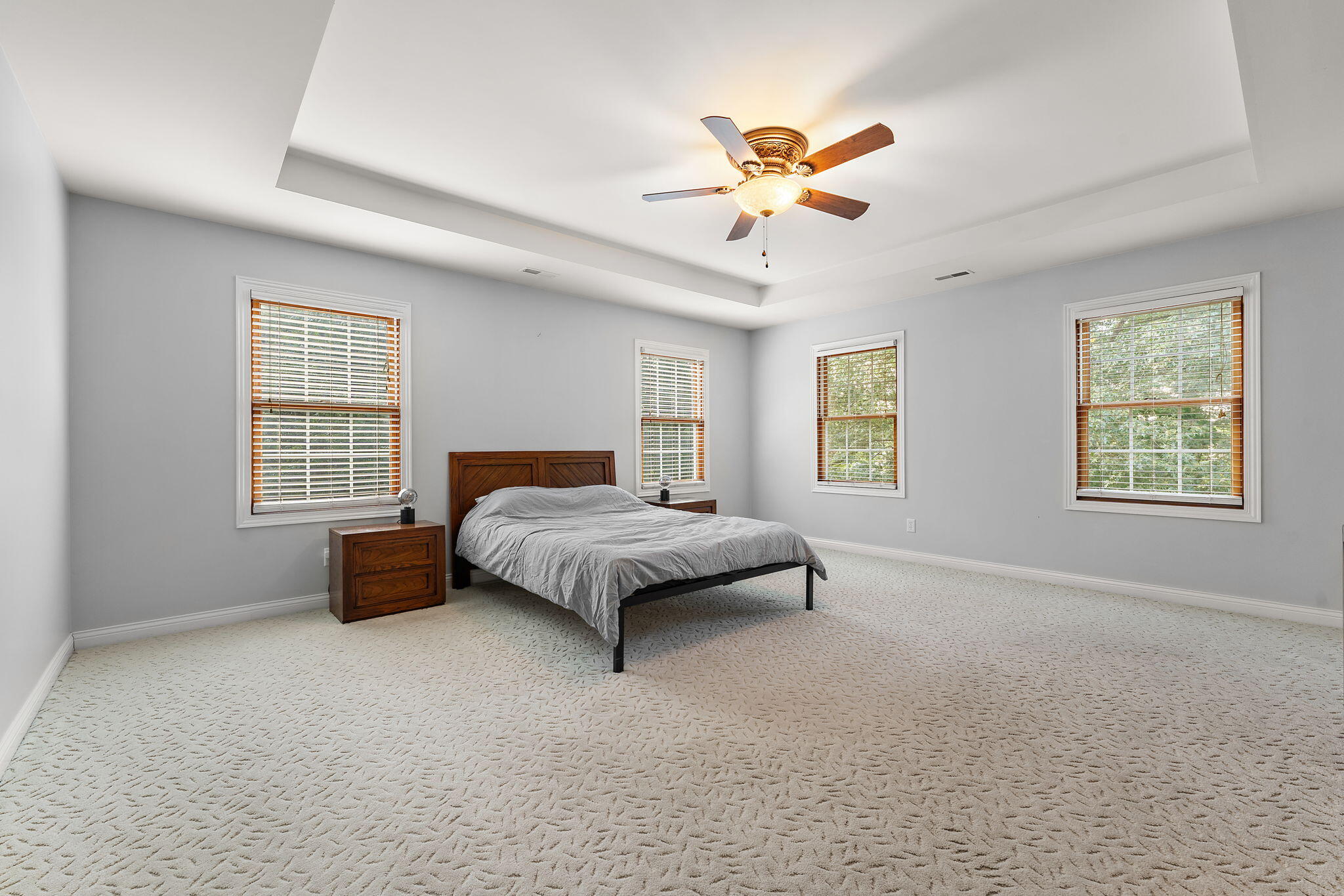 5338 East Lawler Court, Unit 67 Demotte, IN 46310 - Photo 25 of 49 a spacious bedroom with a large bed and a chandelier