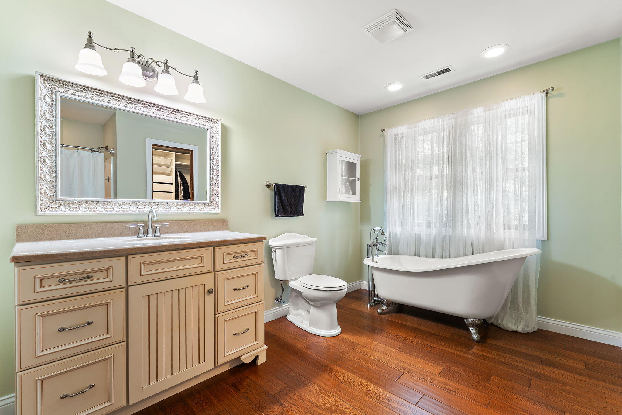 5338 East Lawler Court, Unit 67 Demotte, IN 46310 - Photo 26 of 49 a spacious bathroom with a double vanity sink a mirror and a toilet