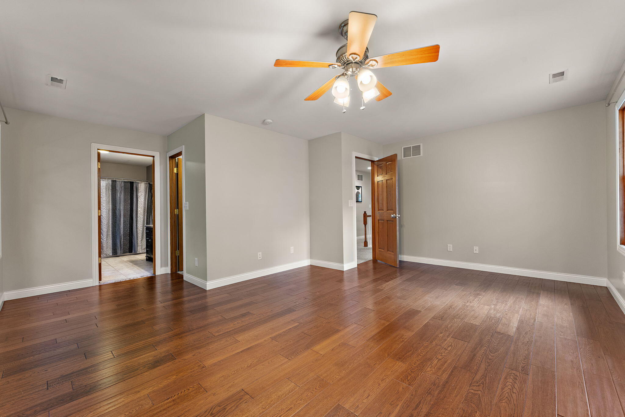 5338 East Lawler Court, Unit 67 Demotte, IN 46310 - Photo 29 of 49 a view of an empty room with wooden floor