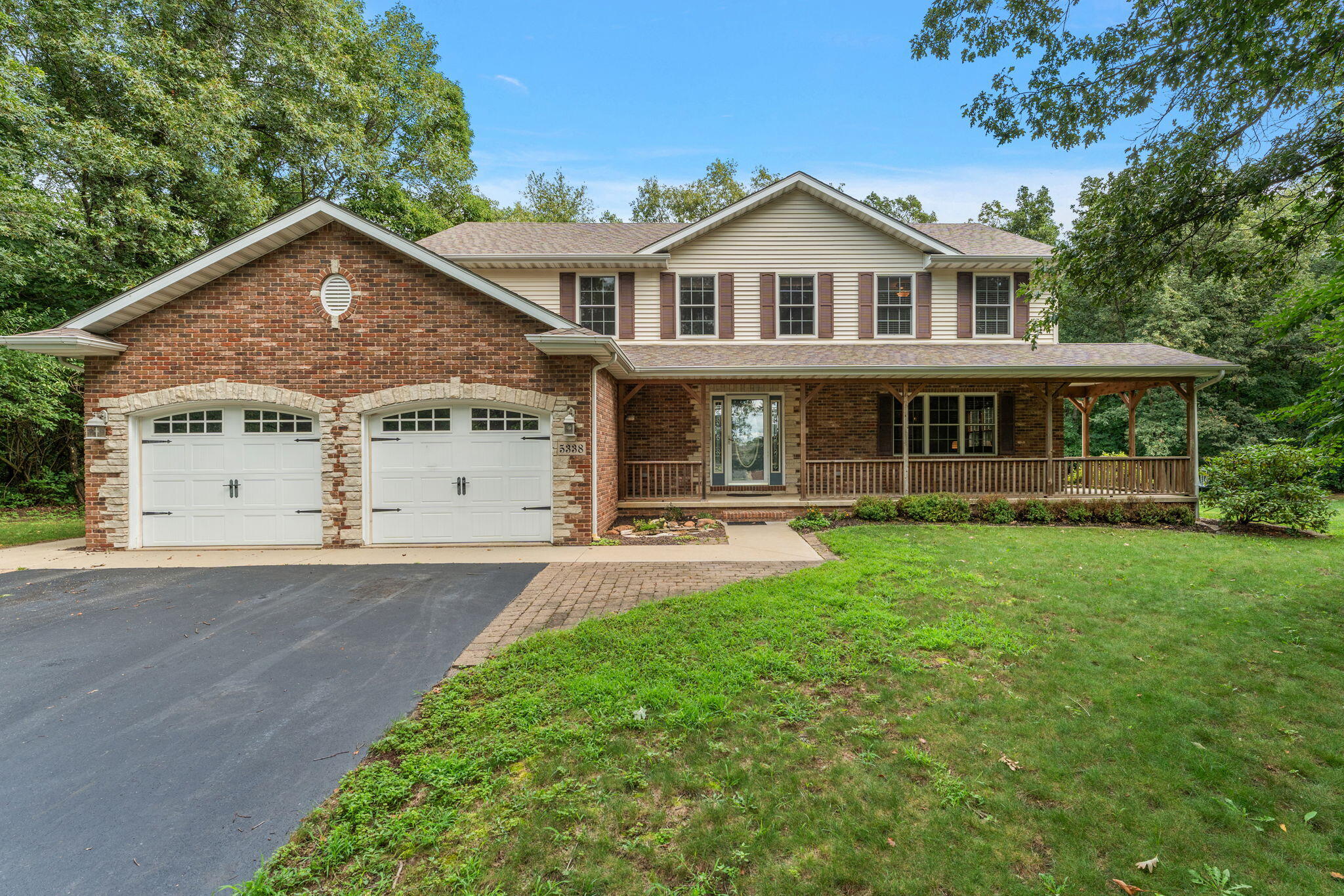 5338 East Lawler Court, Unit 67 Demotte, IN 46310 - Photo 3 of 49 a front view of a house with yard and green space