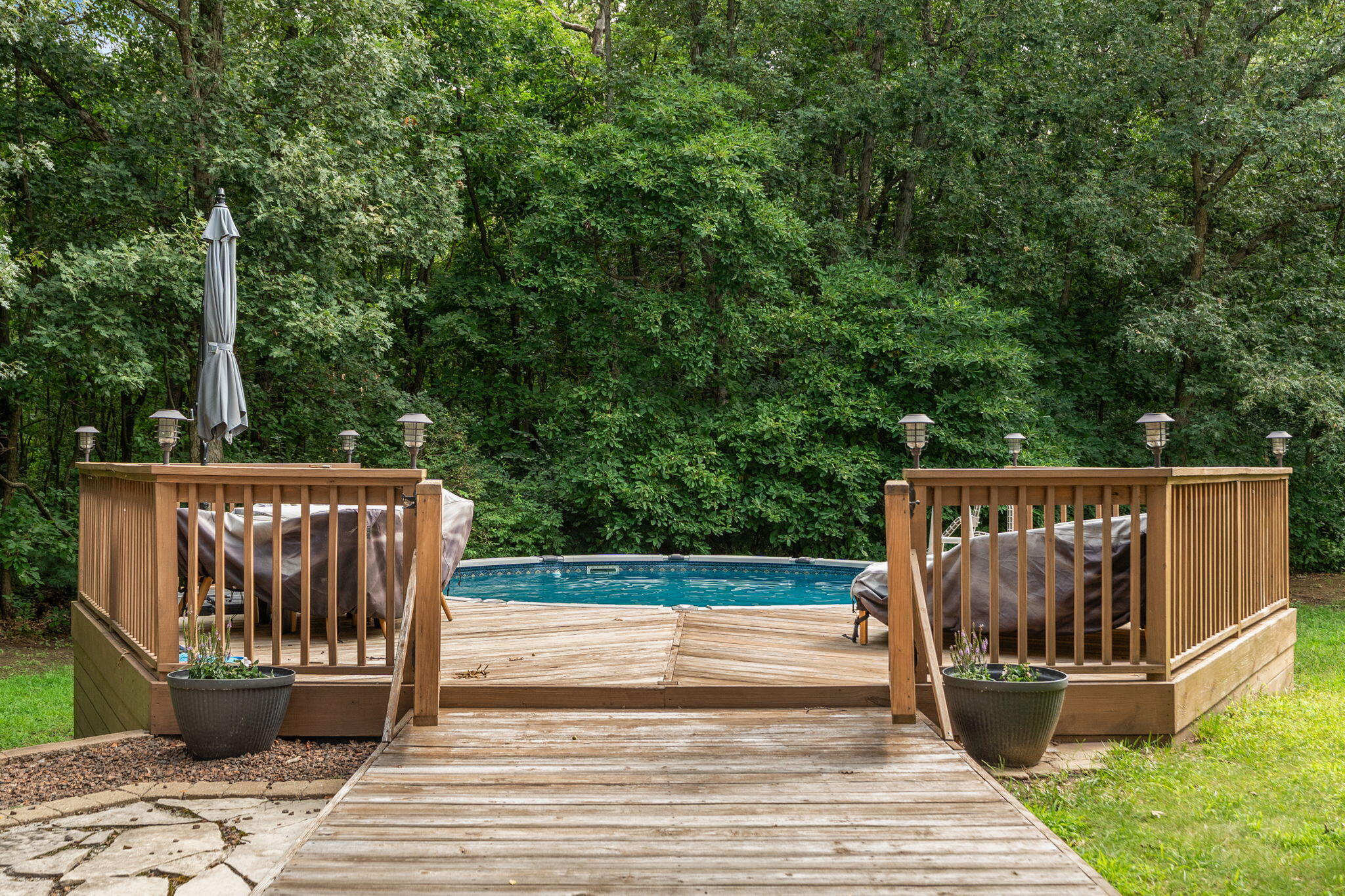 5338 East Lawler Court, Unit 67 Demotte, IN 46310 - Photo 39 of 49 a view of deck with a chair and wooden floor