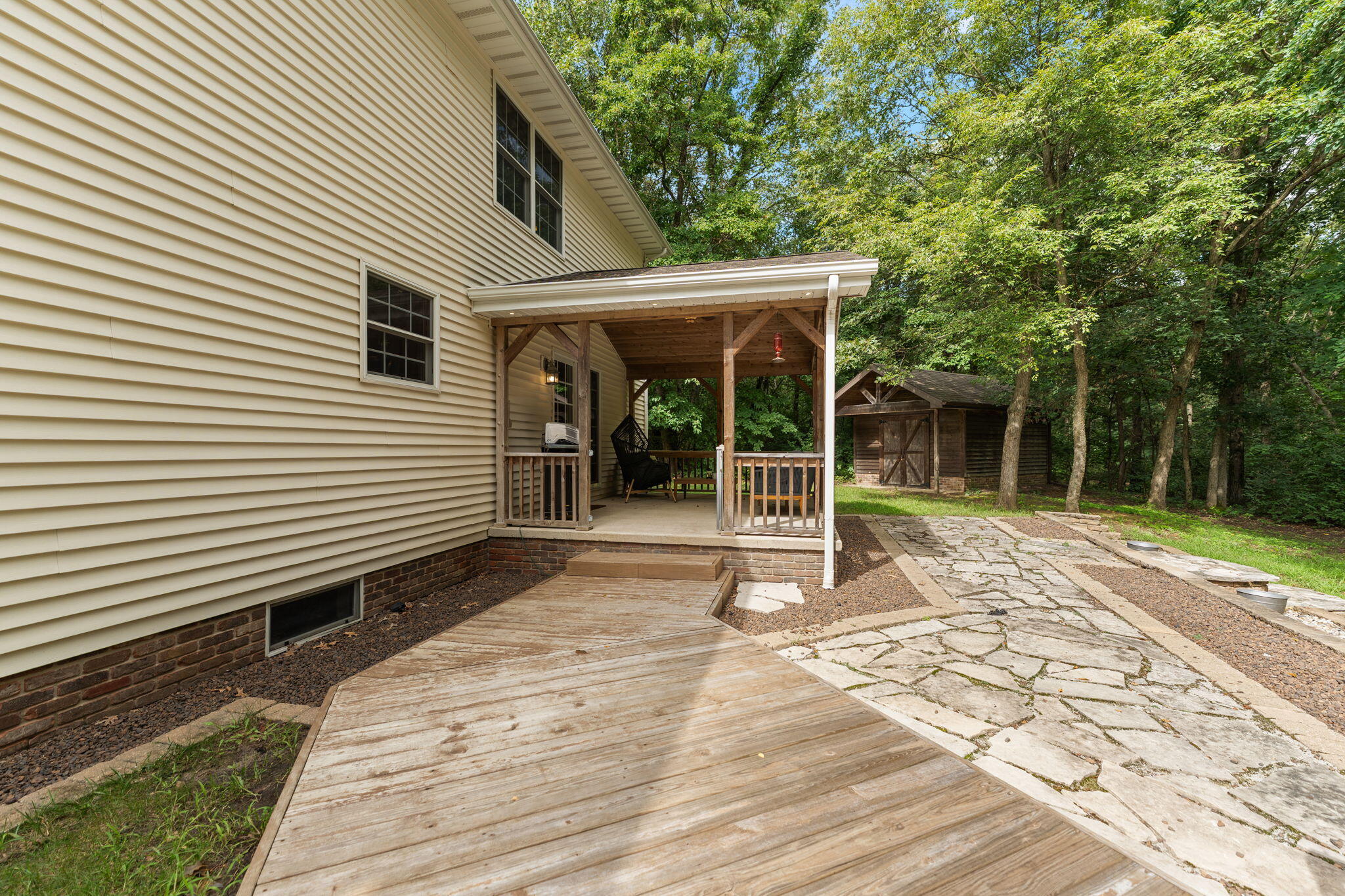 5338 East Lawler Court, Unit 67 Demotte, IN 46310 - Photo 42 of 49 a view of a house with a backyard and a large tree