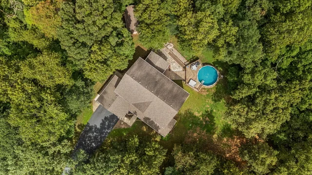 a view of a house in a forest