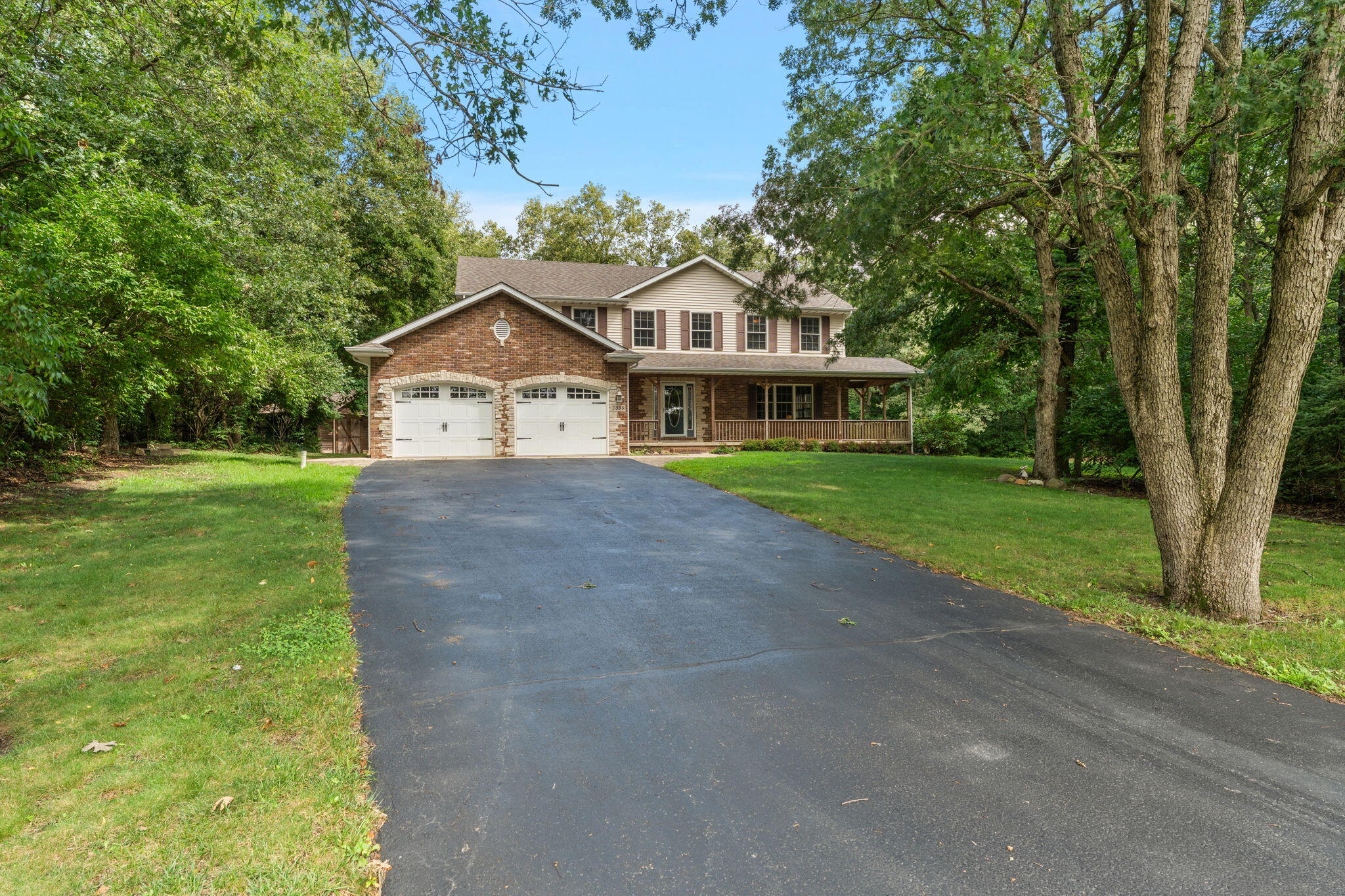 5338 East Lawler Court, Unit 67 Demotte, IN 46310 - Photo 7 of 49 a front view of a house with garden