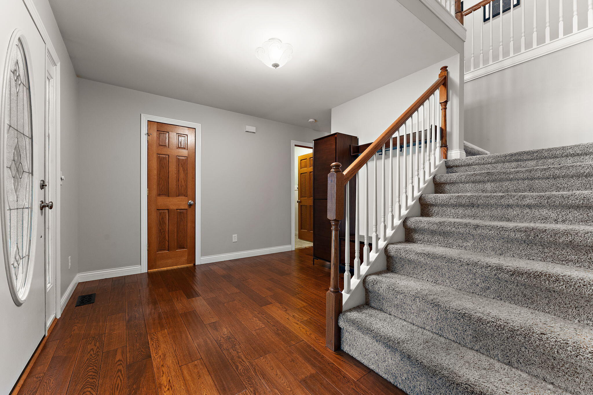 5338 East Lawler Court, Unit 67 Demotte, IN 46310 - Photo 10 of 49 a view of an entryway with wooden floor