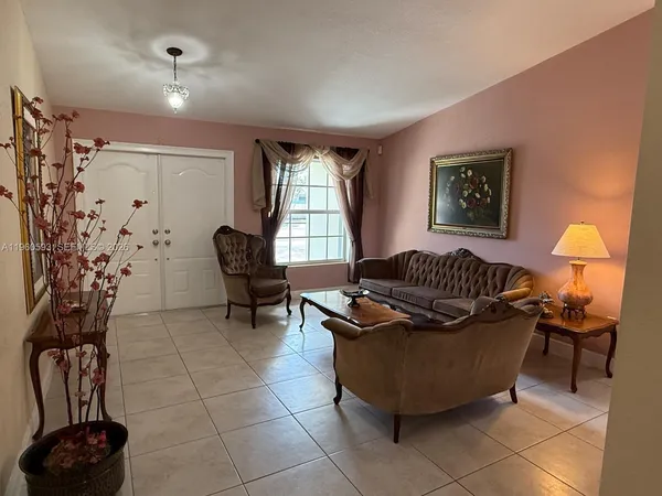 a living room with furniture and a window
