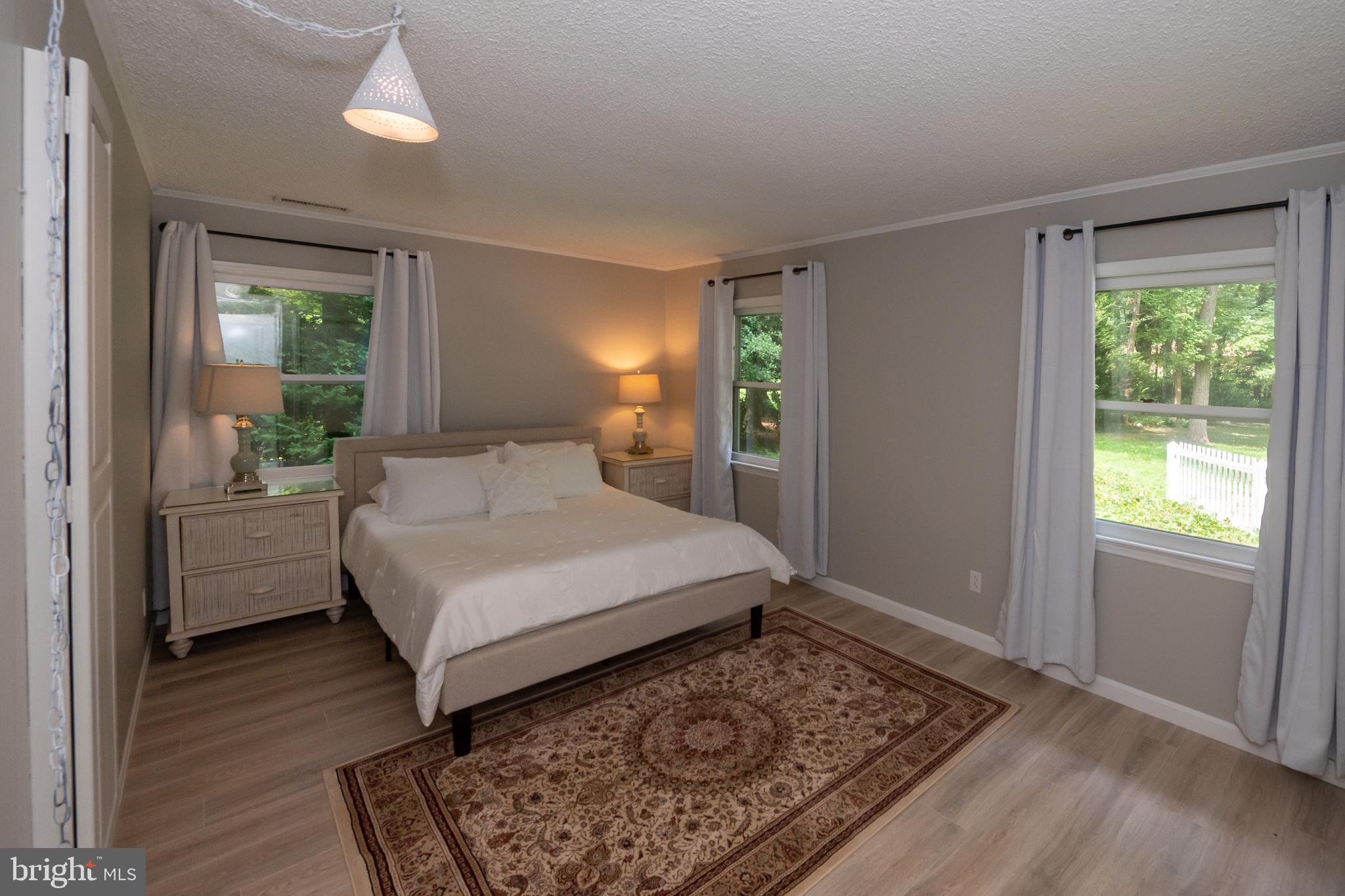 31091 Carioca Road Delmar, MD 21875 - Photo 19 of 28 a bedroom with a bed wooden floor and window