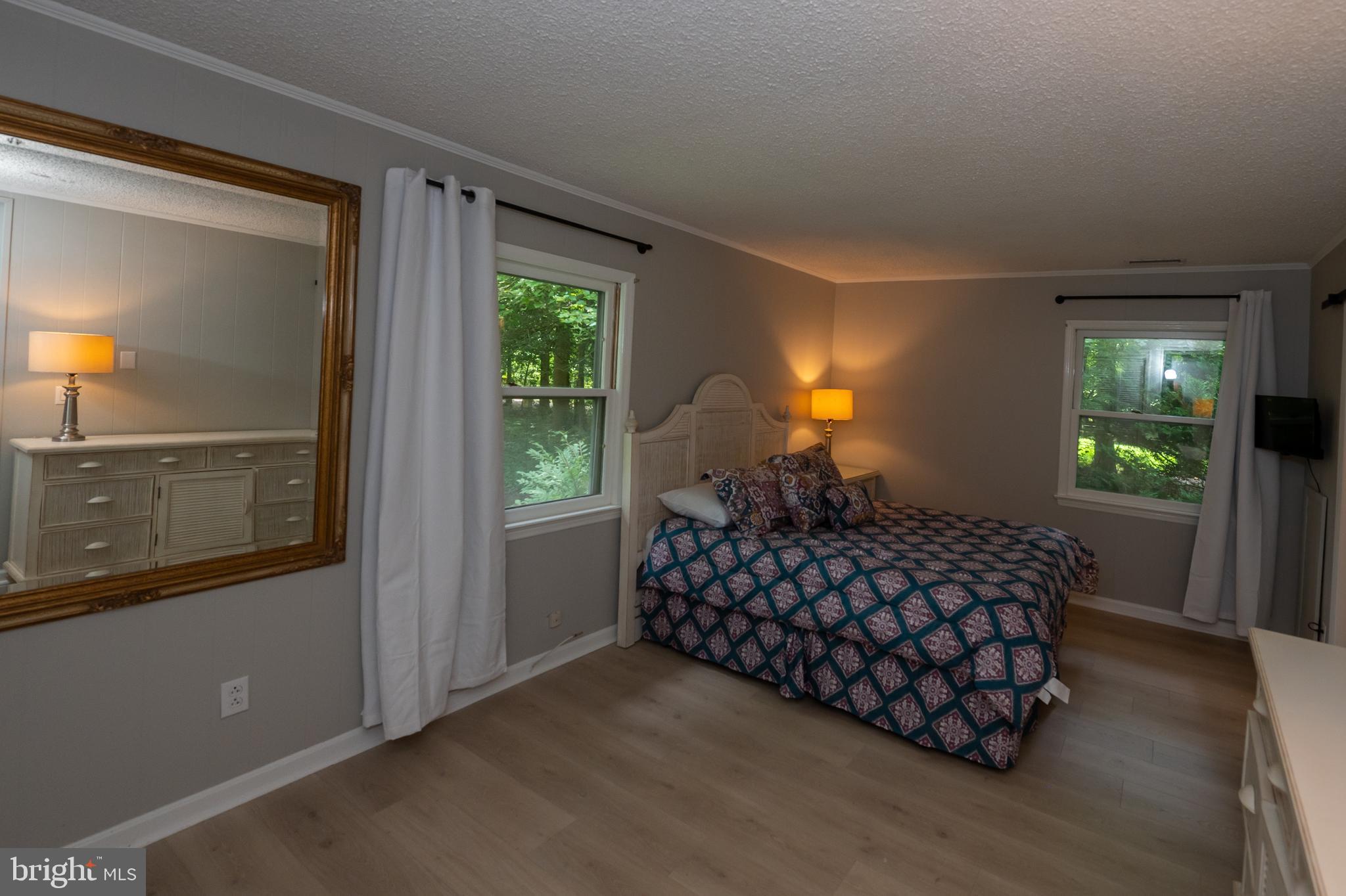 31091 Carioca Road Delmar, MD 21875 - Photo 22 of 28 a bed sitting in a bedroom next to a window