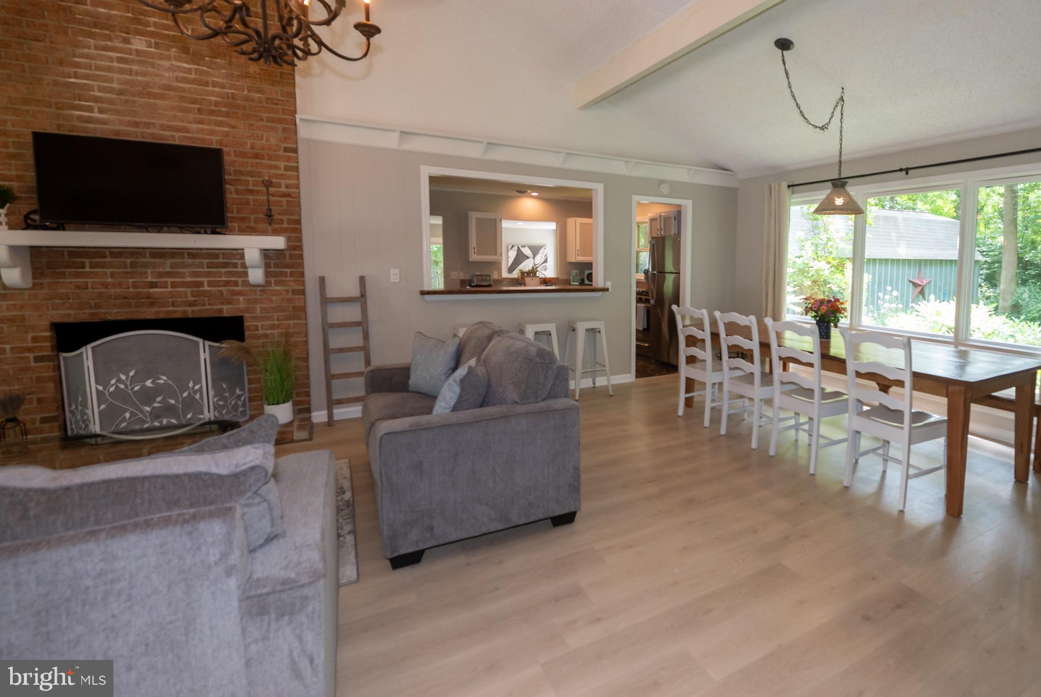 31091 Carioca Road Delmar, MD 21875 - Photo 7 of 28 a living room with furniture a flat screen tv and a fireplace