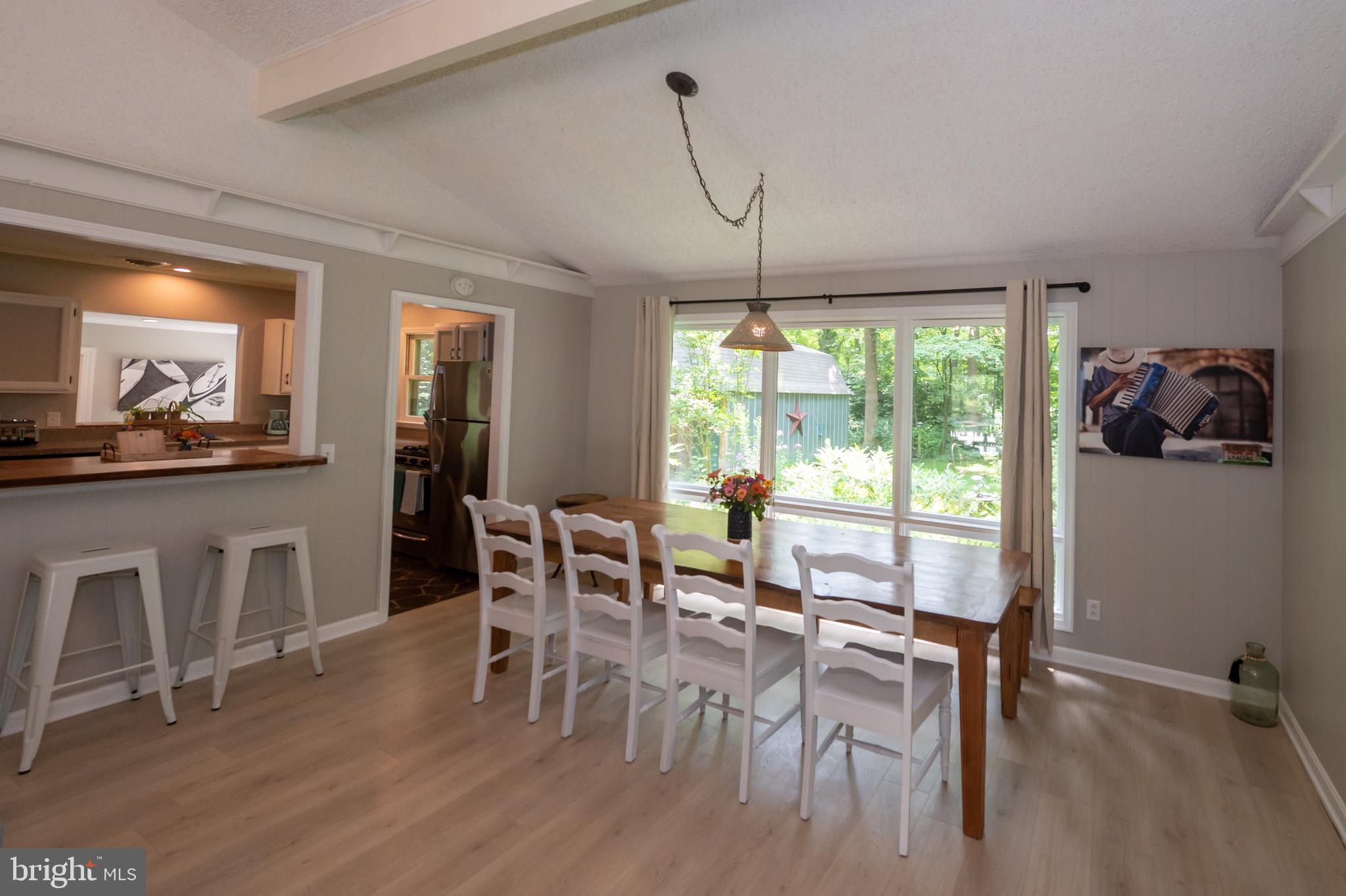 31091 Carioca Road Delmar, MD 21875 - Photo 8 of 28 a view of a dining room with furniture window and wooden floor