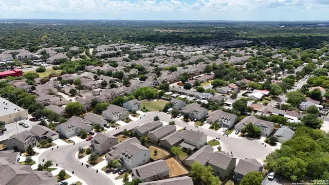 an aerial view of a city with lots of residential buildings