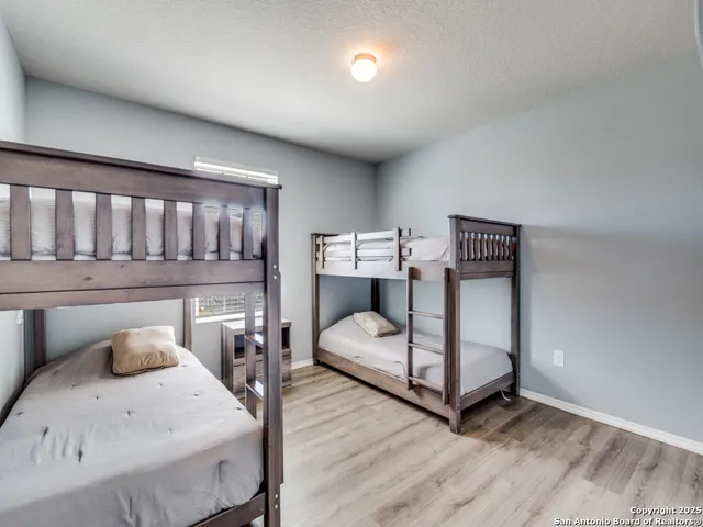 a bedroom with furniture and a chandelier