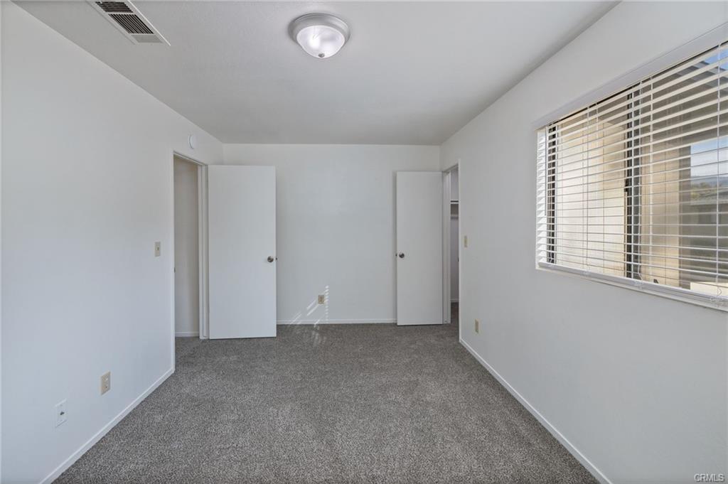 49400 River Park Road, Unit 17 Oakhurst, CA 93644 - Photo 28 of 34 an empty room with windows