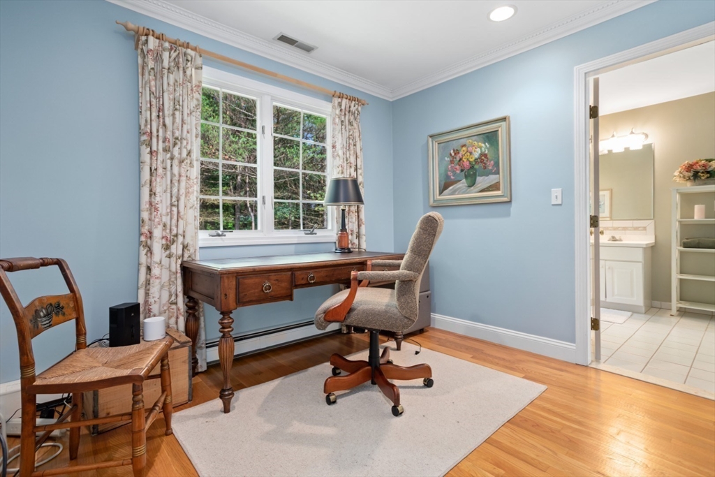105 Flint Farm Road Middleton, MA 01949 - Photo 15 of 25 a view of a workspace with furniture and a window