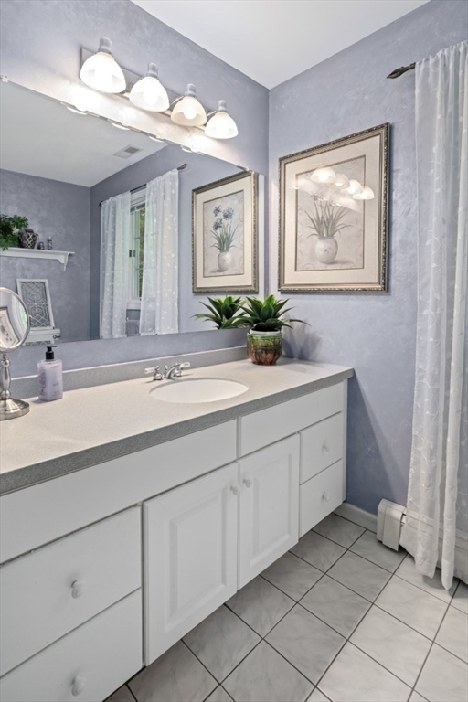 105 Flint Farm Road Middleton, MA 01949 - Photo 16 of 25 a bathroom with a sink and a mirror