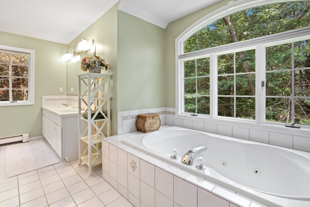 105 Flint Farm Road Middleton, MA 01949 - Photo 17 of 25 a bathroom with a tub sink and window