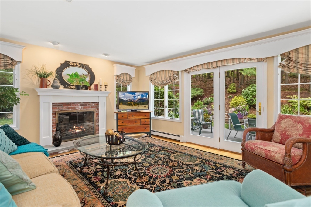 105 Flint Farm Road Middleton, MA 01949 - Photo 9 of 25 a living room with furniture a window and a fireplace