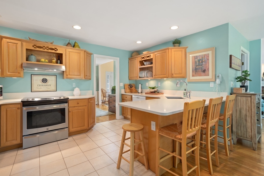 105 Flint Farm Road Middleton, MA 01949 - Photo 10 of 25 a kitchen with stainless steel appliances granite countertop a stove a sink and a refrigerator