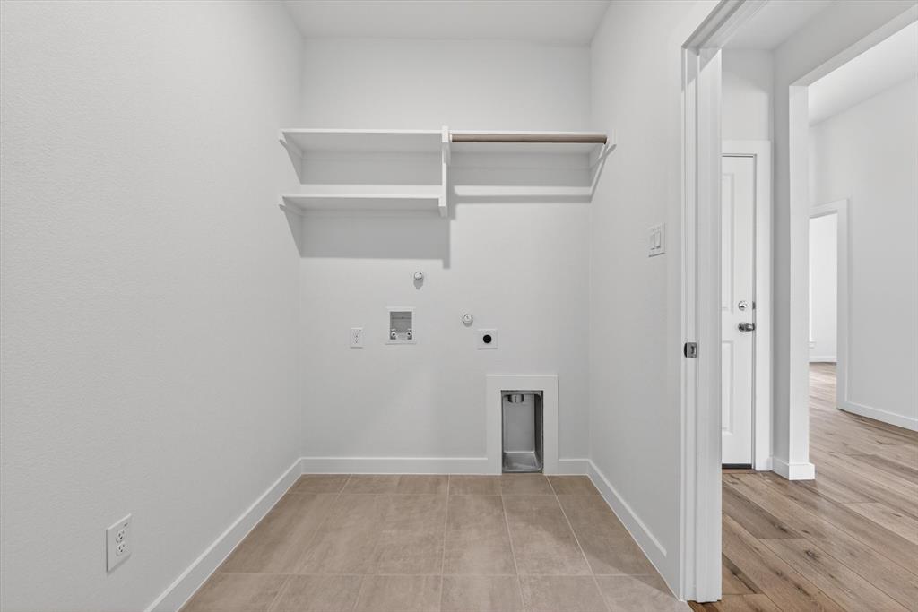 416 McAlpine Drive Springtown, TX 76082 - Photo 19 of 40 Dedicated laundry area featuring ceramic tile flooring and crisp white walls