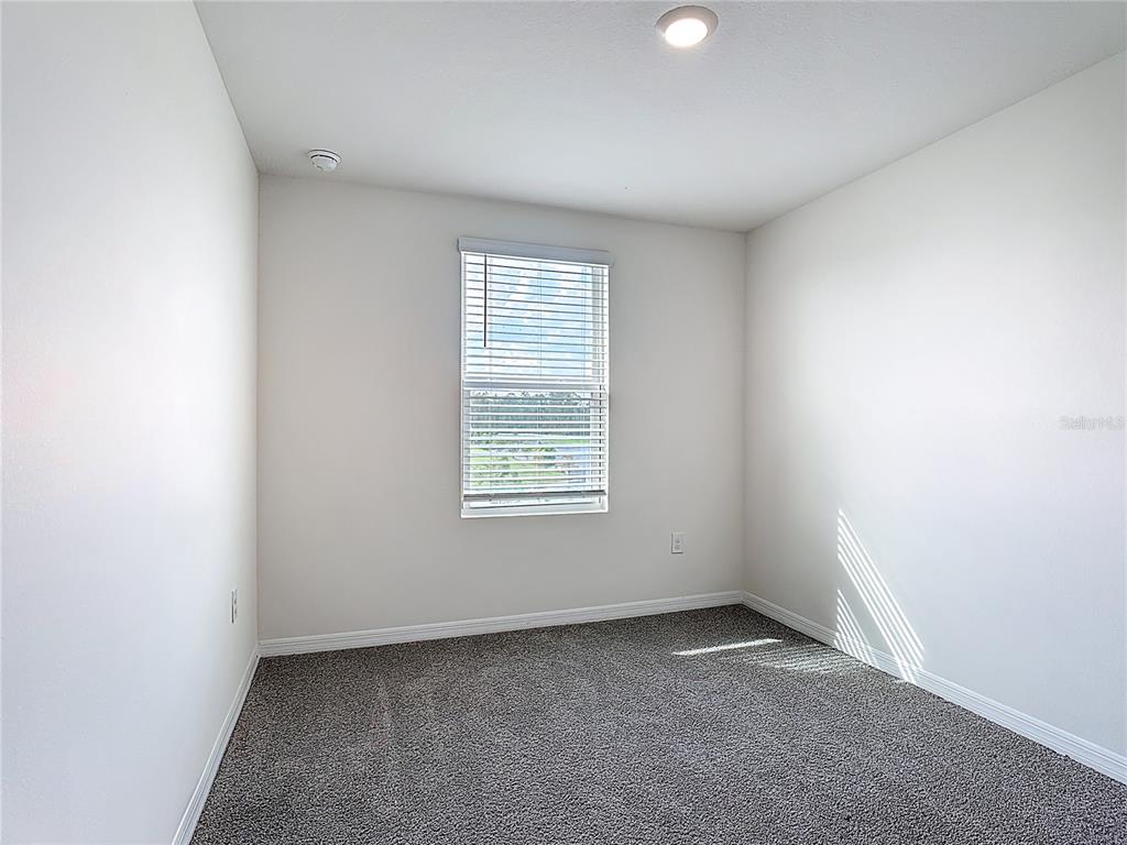 6632 Druid Way St. Cloud, FL 34773 - Photo 13 of 38 an empty room with a window