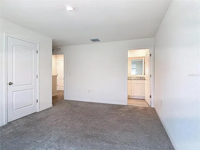 wooden floor and white wall in a room