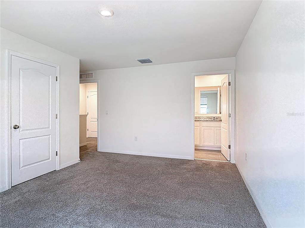 6632 Druid Way St. Cloud, FL 34773 - Photo 15 of 38 wooden floor and white wall in a room