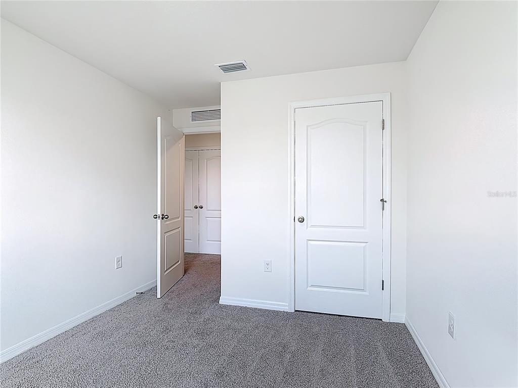 6632 Druid Way St. Cloud, FL 34773 - Photo 18 of 38 an empty room with closet and a bathroom