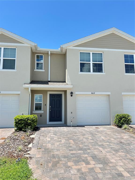 6632 Druid Way St. Cloud, FL 34773 - Photo 2 of 38 a view of a house with a yard