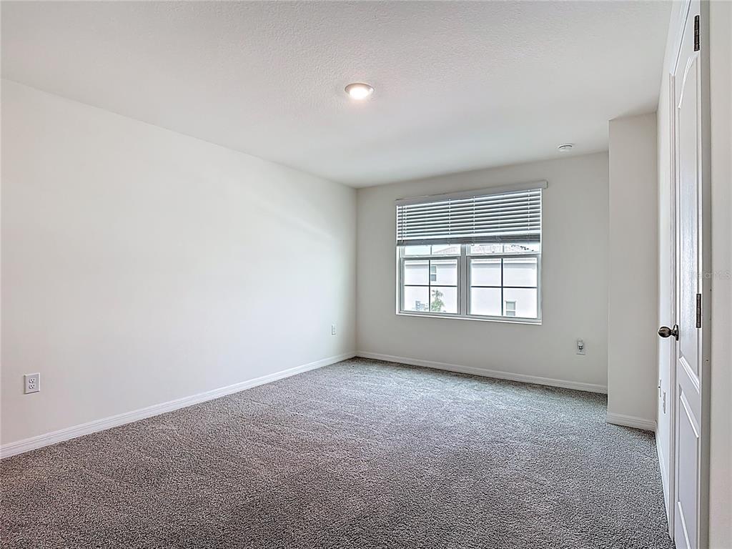 6632 Druid Way St. Cloud, FL 34773 - Photo 23 of 38 an empty room with a window