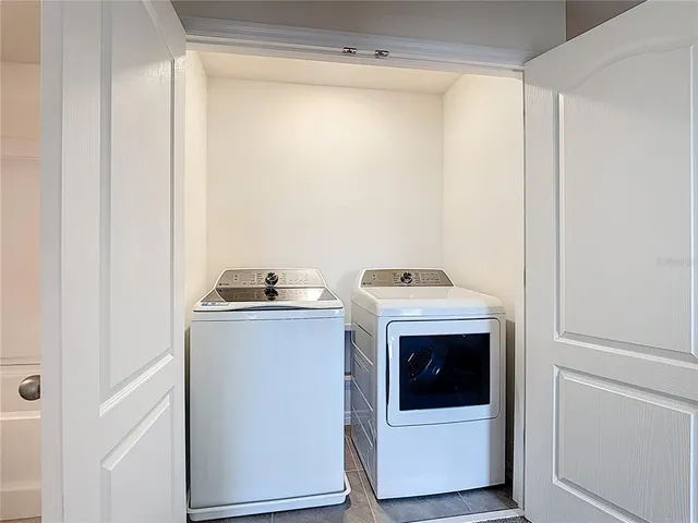 a utility room with washing machine
