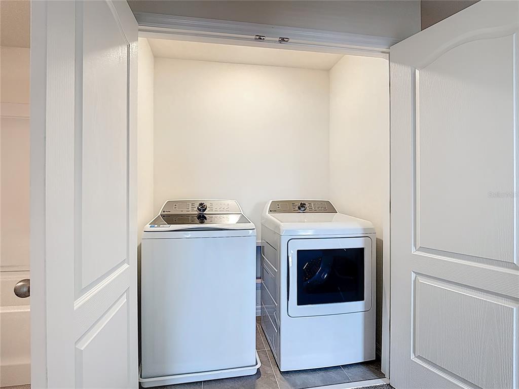 6632 Druid Way St. Cloud, FL 34773 - Photo 26 of 38 a utility room with washing machine