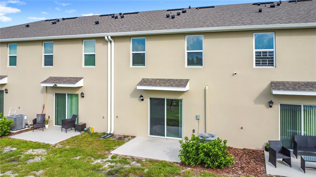 6632 Druid Way St. Cloud, FL 34773 - Photo 30 of 38 a front view of a house with a yard