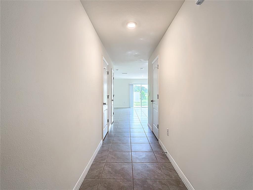 6632 Druid Way St. Cloud, FL 34773 - Photo 5 of 38 a bathroom with a sink and a glass door