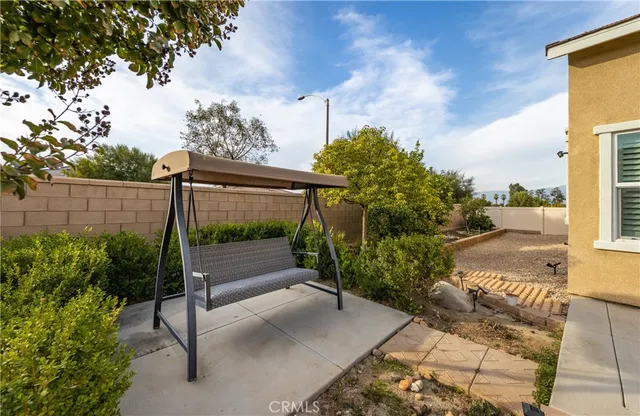 a view of a pathway with a bench in front of it