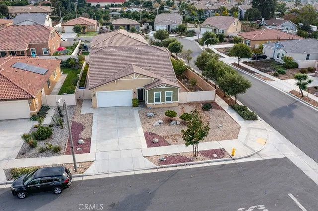 an aerial view of residential houses with street