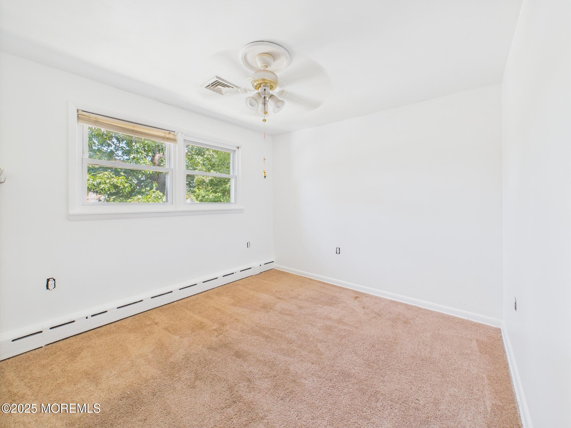 675 Mantoloking Road Brick, NJ 08723 - Photo 6 of 14 an empty room with a window