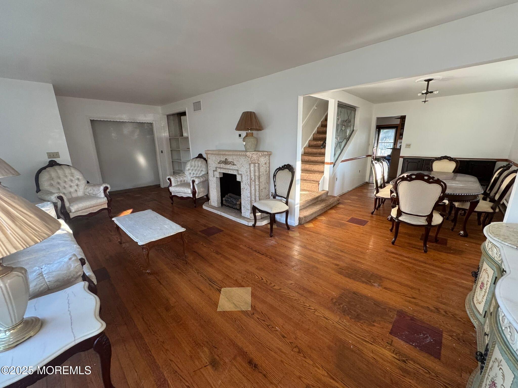 675 Mantoloking Road Brick, NJ 08723 - Photo 7 of 14 a living room with furniture and a fireplace