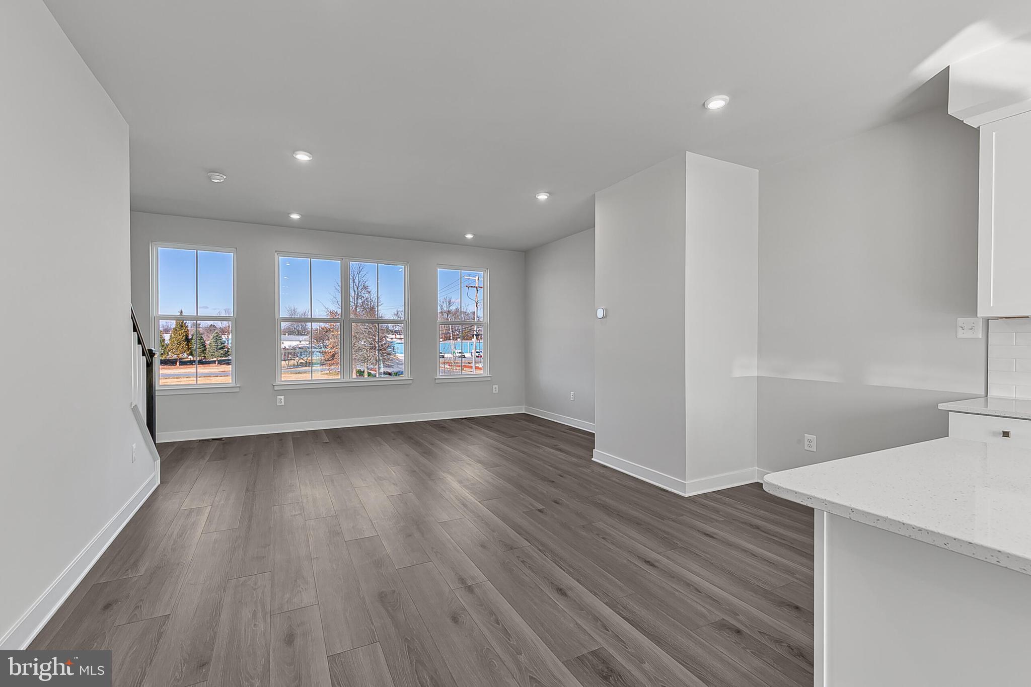 1 D Oasis Avenue Ranson, WV 25438 - Photo 19 of 38 a view of a kitchen with a fridge and wooden floor