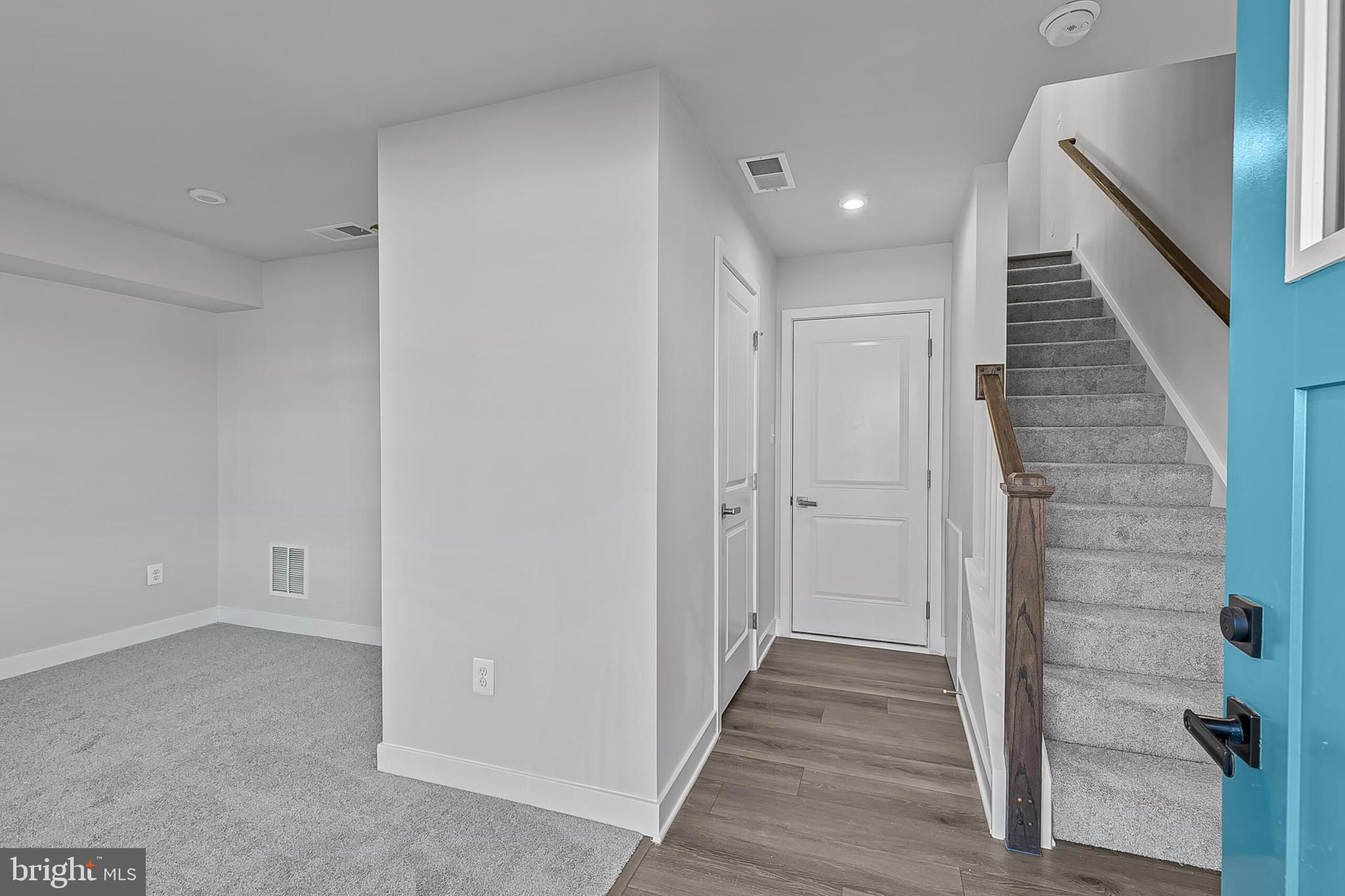 1 D Oasis Avenue Ranson, WV 25438 - Photo 2 of 38 a view of a hallway with wooden floor and staircase