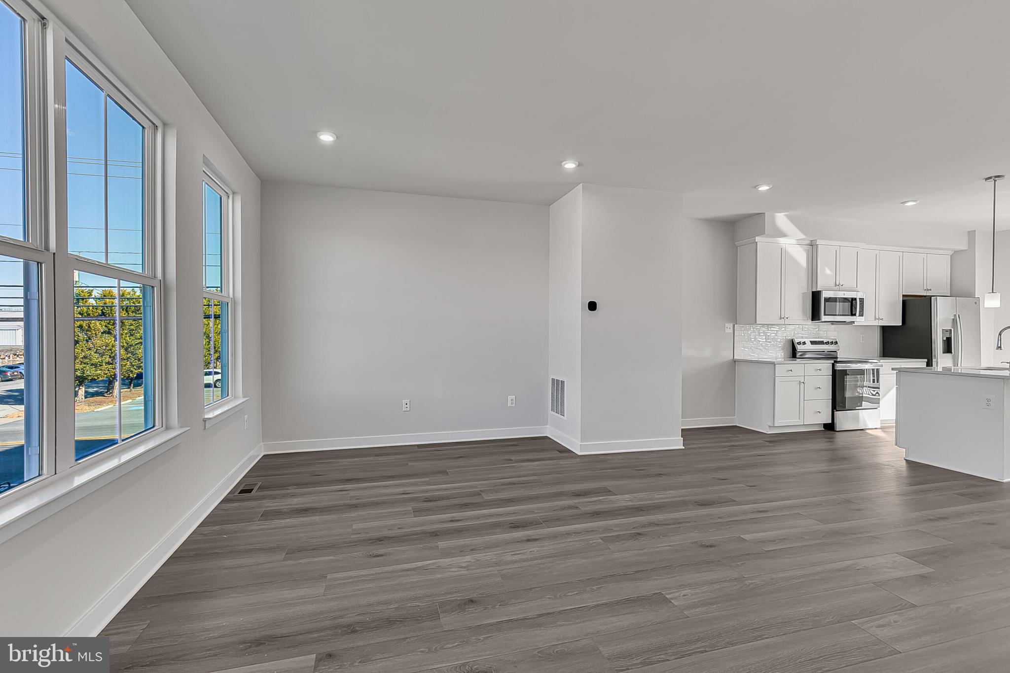 1 D Oasis Avenue Ranson, WV 25438 - Photo 23 of 38 a view of kitchen with wooden floor and window