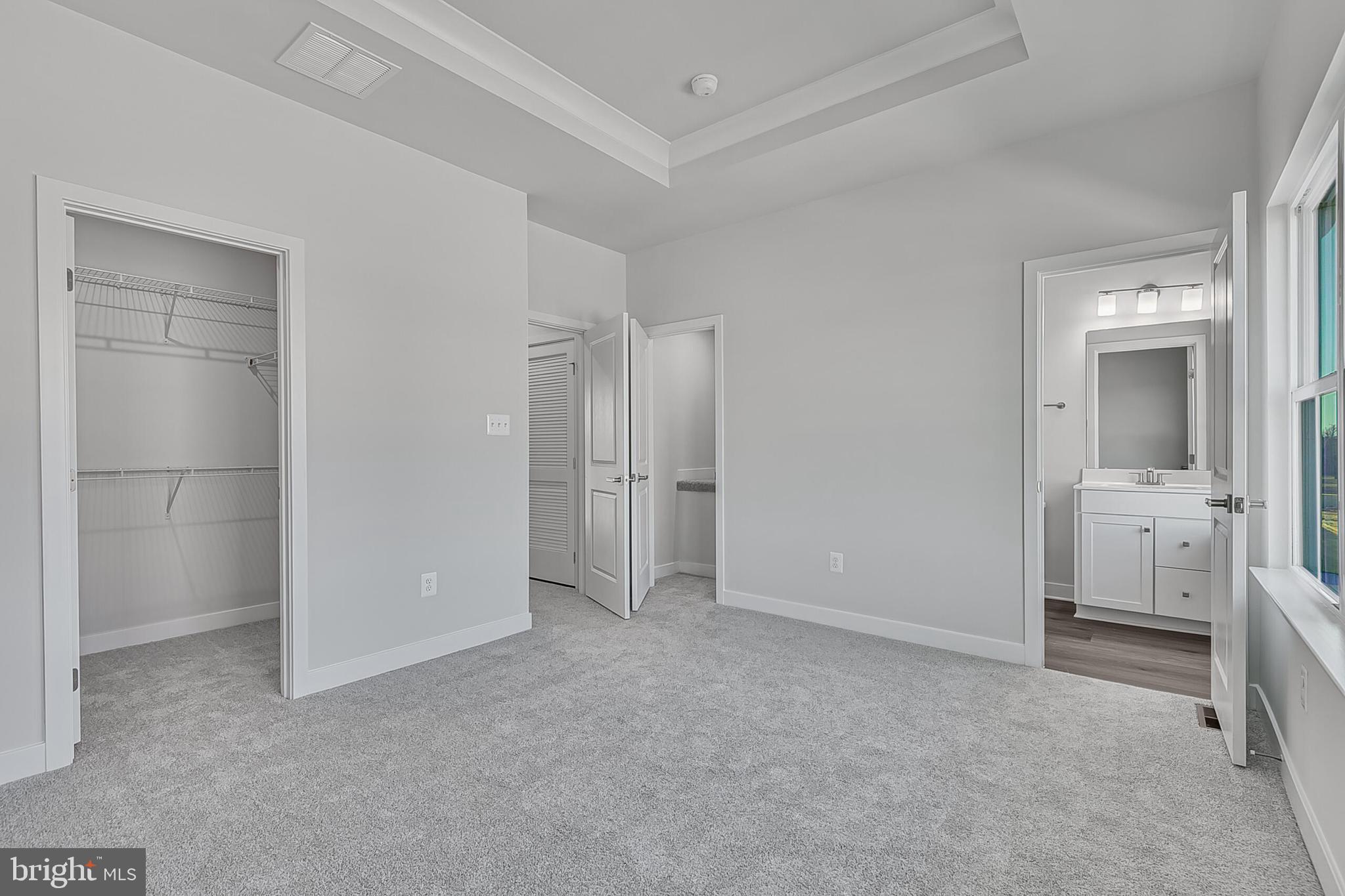 1 D Oasis Avenue Ranson, WV 25438 - Photo 32 of 38 a view of a room with closet and wooden shelves