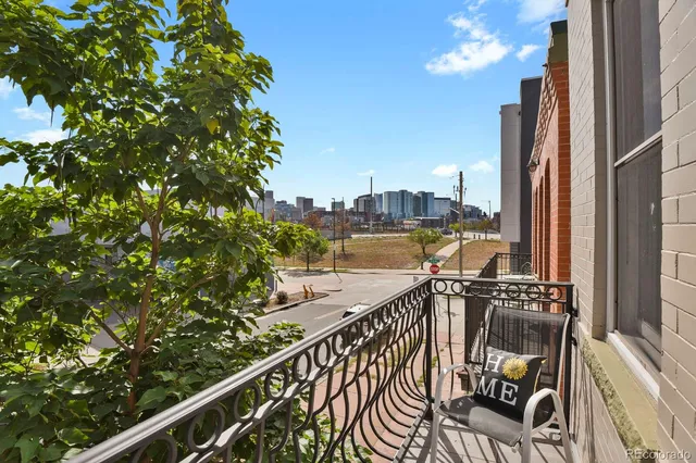a view of balcony with furniture