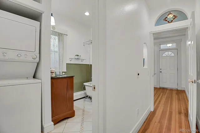 a bathroom with a granite countertop sink mirror vanity and toilet