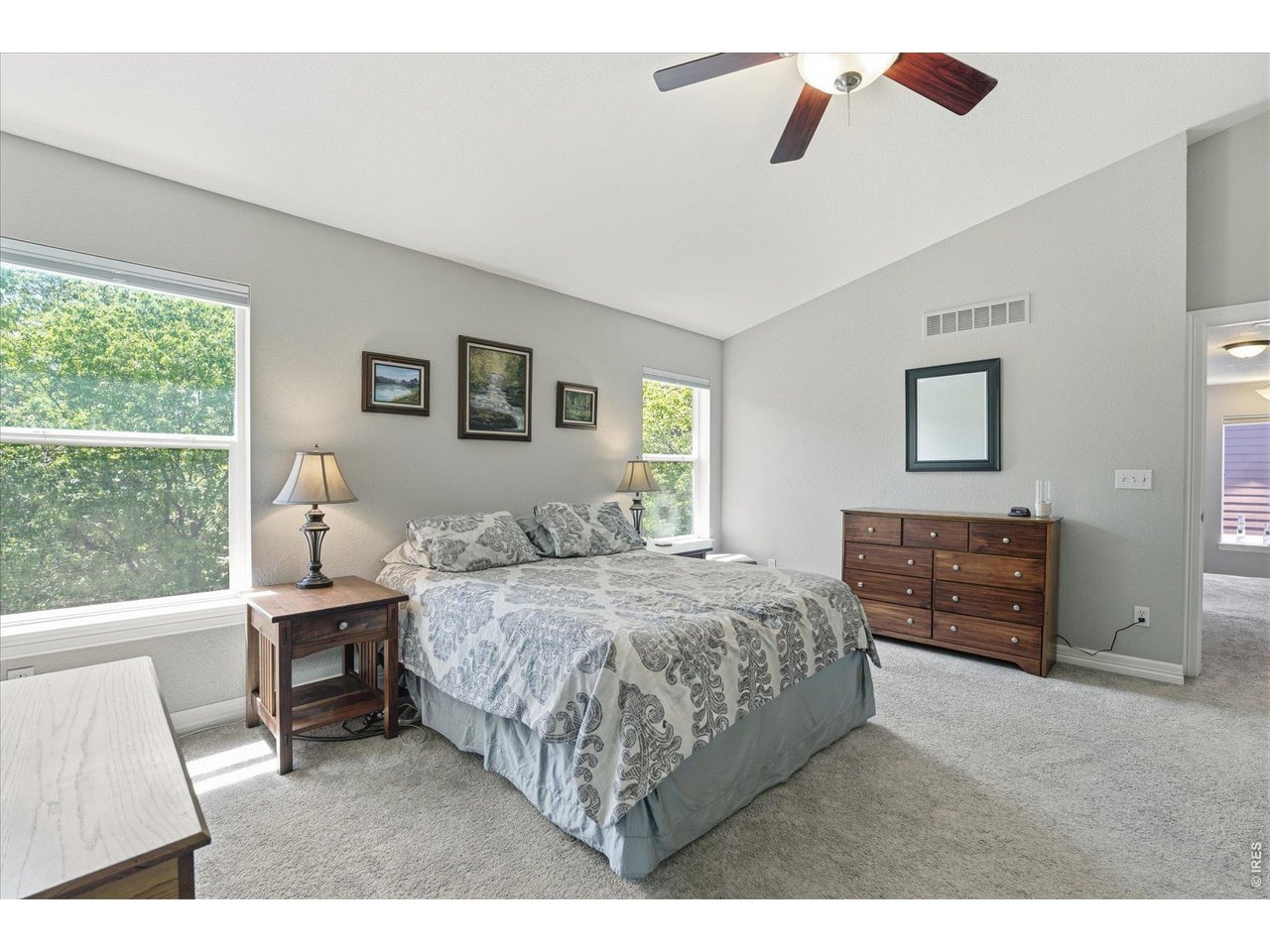 651 Americana Road Longmont, CO 80504 - Photo 27 of 50 Primary suite with vaulted ceilings
