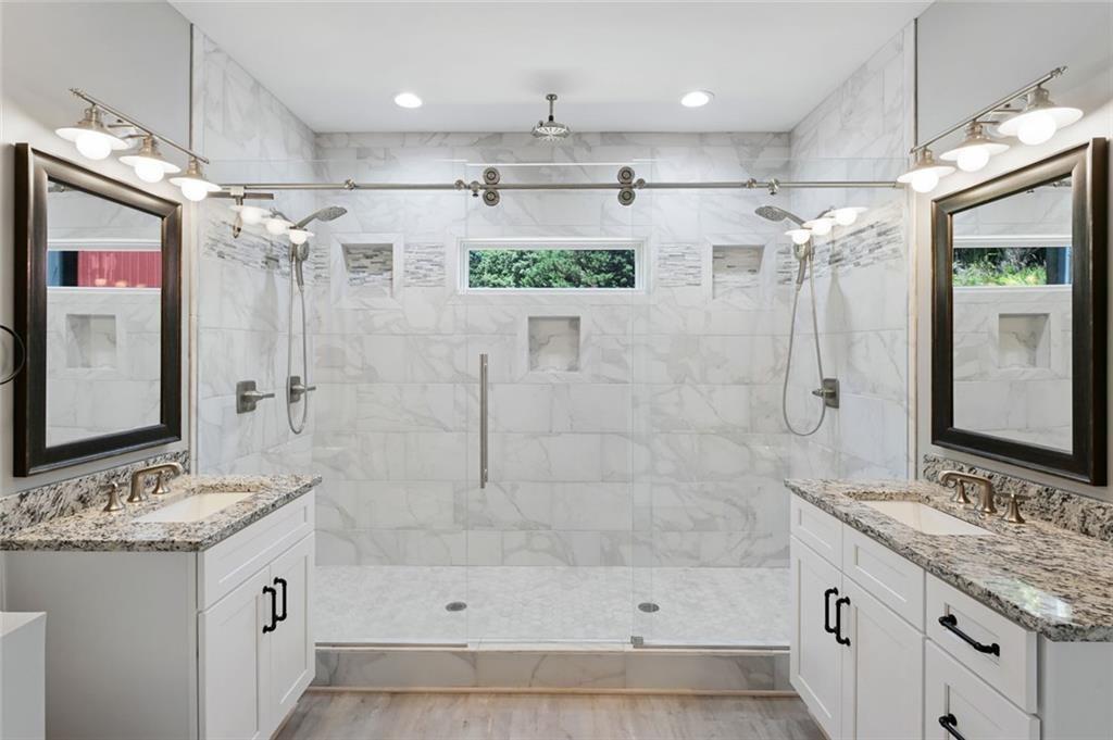 2040 Ridge Road Cumming, GA 30041 - Photo 25 of 52 a bathroom with a granite countertop shower sink and mirror