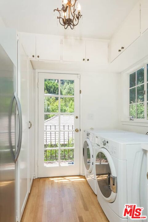 1957 Mandeville Canyon Road Los Angeles, CA 90049 - Photo 24 of 54 a view of utility room with washer and dryer