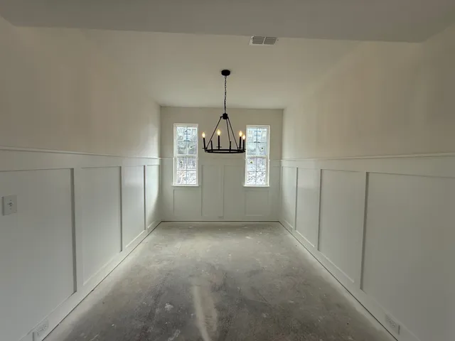 a view of a chandelier in an empty room