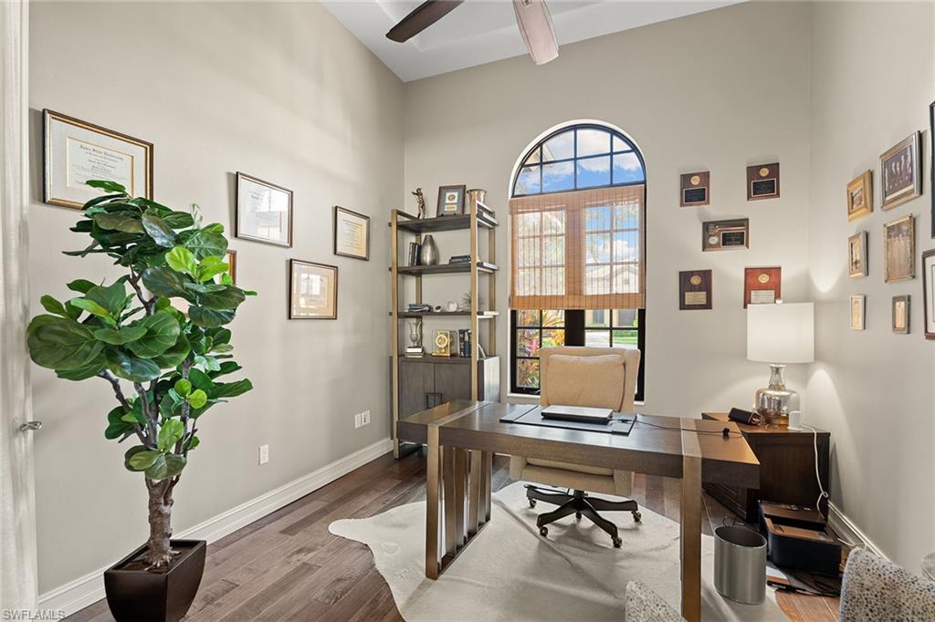 7400 Byrons Way Naples, FL 34113 - Photo 13 of 50 a workspace with furniture and a potted plant